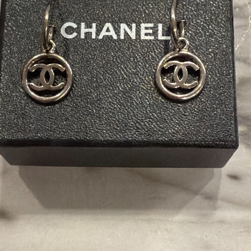 Preloved CHANEL Silver Logo Hoop Earrings comes with box the stamp fell off.